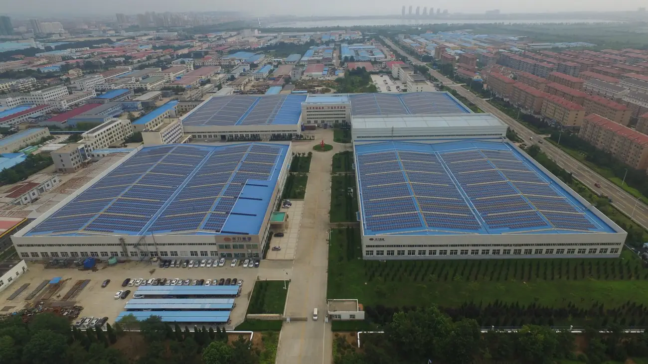 Aerial view of an industrial estate with rooftop solar arrays